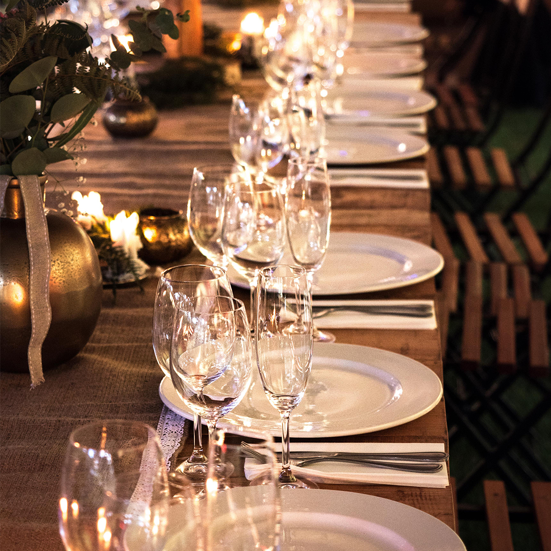 table set with wine glasses for wedding in wine country